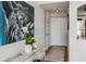 Entryway with statement art piece, console table, and white door at 2870 Pharr Court South Nw # 2404, Atlanta, GA 30305