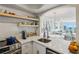 Modern kitchen featuring stainless steel appliances, open shelving, with a full view into the living room at 2870 Pharr Court South Nw # 2404, Atlanta, GA 30305