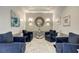 Modern lobby with blue armchairs, marble floors, and accent lighting at 2870 Pharr Court South Nw # 2404, Atlanta, GA 30305