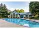 Outdoor community pool with clean water, lounge chairs, and surrounded by lush landscaping at 2870 Pharr Court South Nw # 2404, Atlanta, GA 30305