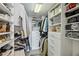 Organized walk-in closet with custom shelving, hanging rods, and ample storage space at 2870 Pharr Court South Nw # 2404, Atlanta, GA 30305