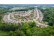 Aerial view showcases the community's layout, with neatly arranged homes and lush green spaces at 333 Gardens Of Harmony Dr, Canton, GA 30115