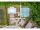 Aerial view of the community amenities, including a pool, tennis courts, and playground at 333 Gardens Of Harmony Dr, Canton, GA 30115