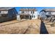 Large backyard featuring a covered patio and a well-maintained lawn, perfect for outdoor entertaining at 333 Gardens Of Harmony Dr, Canton, GA 30115