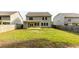Expansive backyard with a covered patio, offering plenty of room for recreation and enjoying the outdoors at 333 Gardens Of Harmony Dr, Canton, GA 30115