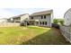 Large fenced backyard with a covered patio, providing ample space for outdoor activities and gatherings at 333 Gardens Of Harmony Dr, Canton, GA 30115