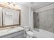 Bathroom with vanity, granite countertops, and a tiled shower-tub at 333 Gardens Of Harmony Dr, Canton, GA 30115
