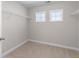 Walk-in closet with carpet floors and metal shelving at 333 Gardens Of Harmony Dr, Canton, GA 30115