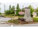 The 'Gardens of Harmony' stone entrance sign with colorful flowerbed in a peaceful neighborhood at 333 Gardens Of Harmony Dr, Canton, GA 30115