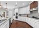 Elegant kitchen featuring granite countertops, stainless steel appliances, and a stylish backsplash at 333 Gardens Of Harmony Dr, Canton, GA 30115