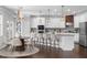 Modern kitchen with stainless steel appliances, granite countertops, a center island, and a breakfast nook at 333 Gardens Of Harmony Dr, Canton, GA 30115