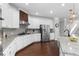 Beautiful kitchen with granite countertops, stainless appliances, and hardwood floors adjacent to staircase at 333 Gardens Of Harmony Dr, Canton, GA 30115