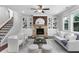 Inviting living room with stone fireplace, custom built-ins, and plush seating, great for Gathering gatherings at 333 Gardens Of Harmony Dr, Canton, GA 30115
