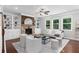 Elegant living room featuring built-in shelving, a fireplace, and comfortable seating, perfect for relaxing at 333 Gardens Of Harmony Dr, Canton, GA 30115