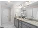 Bathroom featuring double sinks, granite counters, tile floors, and white cabinets at 333 Gardens Of Harmony Dr, Canton, GA 30115