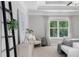 This main bedroom offers a trey ceiling, a ceiling fan, a window, and neutral decor at 333 Gardens Of Harmony Dr, Canton, GA 30115