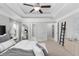 This main bedroom offers a trey ceiling, neutral decor, and an ensuite at 333 Gardens Of Harmony Dr, Canton, GA 30115
