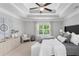 This main bedroom offers a trey ceiling, a ceiling fan, a window, and neutral decor at 333 Gardens Of Harmony Dr, Canton, GA 30115
