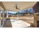 Covered patio with ceiling fan, brick fireplace, and outdoor space, perfect for entertaining and relaxing at 333 Gardens Of Harmony Dr, Canton, GA 30115