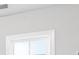 An empty white wall next to a window at 333 Gardens Of Harmony Dr, Canton, GA 30115