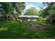 The backyard is complete with a lawn and an outbuilding at 377 Black Oak Ct, Lawrenceville, GA 30046