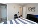 View of bedroom with a world map art and a peek into the closet at 377 Black Oak Ct, Lawrenceville, GA 30046