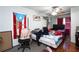 Cozy bedroom with a comfortable bed and a Puerto Rican flag on the door at 377 Black Oak Ct, Lawrenceville, GA 30046