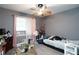 Relaxing bedroom featuring wood-look floors and a soft color palette at 377 Black Oak Ct, Lawrenceville, GA 30046