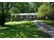 Charming one-story home with a well-manicured lawn and a cozy front porch at 377 Black Oak Ct, Lawrenceville, GA 30046