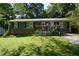 Classic one-story house with a welcoming porch and a beautifully maintained front lawn at 377 Black Oak Ct, Lawrenceville, GA 30046