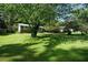 Charming home with lush green front yard and mature trees at 377 Black Oak Ct, Lawrenceville, GA 30046
