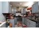 Efficient kitchen layout with gray cabinets, stainless steel appliances and modern fixtures at 377 Black Oak Ct, Lawrenceville, GA 30046