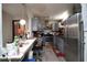 Functional kitchen featuring stainless steel appliances, gray cabinets, and a breakfast bar at 377 Black Oak Ct, Lawrenceville, GA 30046