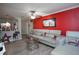 Inviting living room featuring a stylish sofa, a glass table and a vibrant accent wall at 377 Black Oak Ct, Lawrenceville, GA 30046