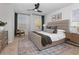 Main bedroom featuring a king bed, large windows, a ceiling fan and neutral decor at 109 Meadowview Dr, Temple, GA 30179