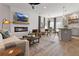 Open concept living space with fireplace, stylish seating, and adjacent dining area and kitchen at 111 Meadowview Dr, Temple, GA 30179