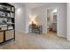 Upstairs loft with a desk, bookcase, and doorway to a bathroom at 111 Meadowview Dr, Temple, GA 30179