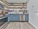 Stylish kitchen featuring stainless steel appliances, modern cabinetry, tile backsplash and plenty of counter space at 215 Little Brook Ln, Woodstock, GA 30188