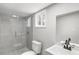 This renovated bathroom offers a glass-enclosed shower, updated vanity, and a neutral color palette at 2309 Carver Nw Dr, Atlanta, GA 30314