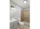 A bathroom boasts an updated vanity and an elegant glass-enclosed tiled shower at 2309 Carver Nw Dr, Atlanta, GA 30314