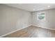 Bedroom featuring wood floors, a bright window, and neutral paint at 2309 Carver Nw Dr, Atlanta, GA 30314