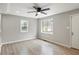 Bright bedroom with wood floors and a view of the outdoors through large windows at 2309 Carver Nw Dr, Atlanta, GA 30314