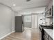 Modern kitchen features stainless steel appliances, granite counters, and wood floors at 2309 Carver Nw Dr, Atlanta, GA 30314