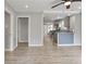 Open-concept living room with wood floors flows into kitchen with granite countertops at 2309 Carver Nw Dr, Atlanta, GA 30314