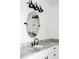 Close-up of a bathroom vanity featuring granite countertops, a sleek sink, and modern black fixtures at 2792 Mathews Se St, Smyrna, GA 30080