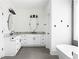 Stylish bathroom boasts granite countertops, white cabinets, black hardware and fixtures, and ample vanity space at 2792 Mathews Se St, Smyrna, GA 30080