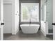 Elegant bathroom with a freestanding tub, modern fixtures, and a separate glass-enclosed shower at 2792 Mathews Se St, Smyrna, GA 30080