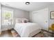 Cozy bedroom with natural light, featuring a stylish rug, comfortable furnishings, and closet at 2792 Mathews Se St, Smyrna, GA 30080