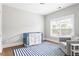 Bright Bedroom featuring stylish rug, comfortable chair and crib with plenty of natural light at 2792 Mathews Se St, Smyrna, GA 30080