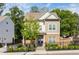 Charming two-story home boasts a brick facade, neutral siding, and a well-manicured front yard with a decorative fence at 2792 Mathews Se St, Smyrna, GA 30080